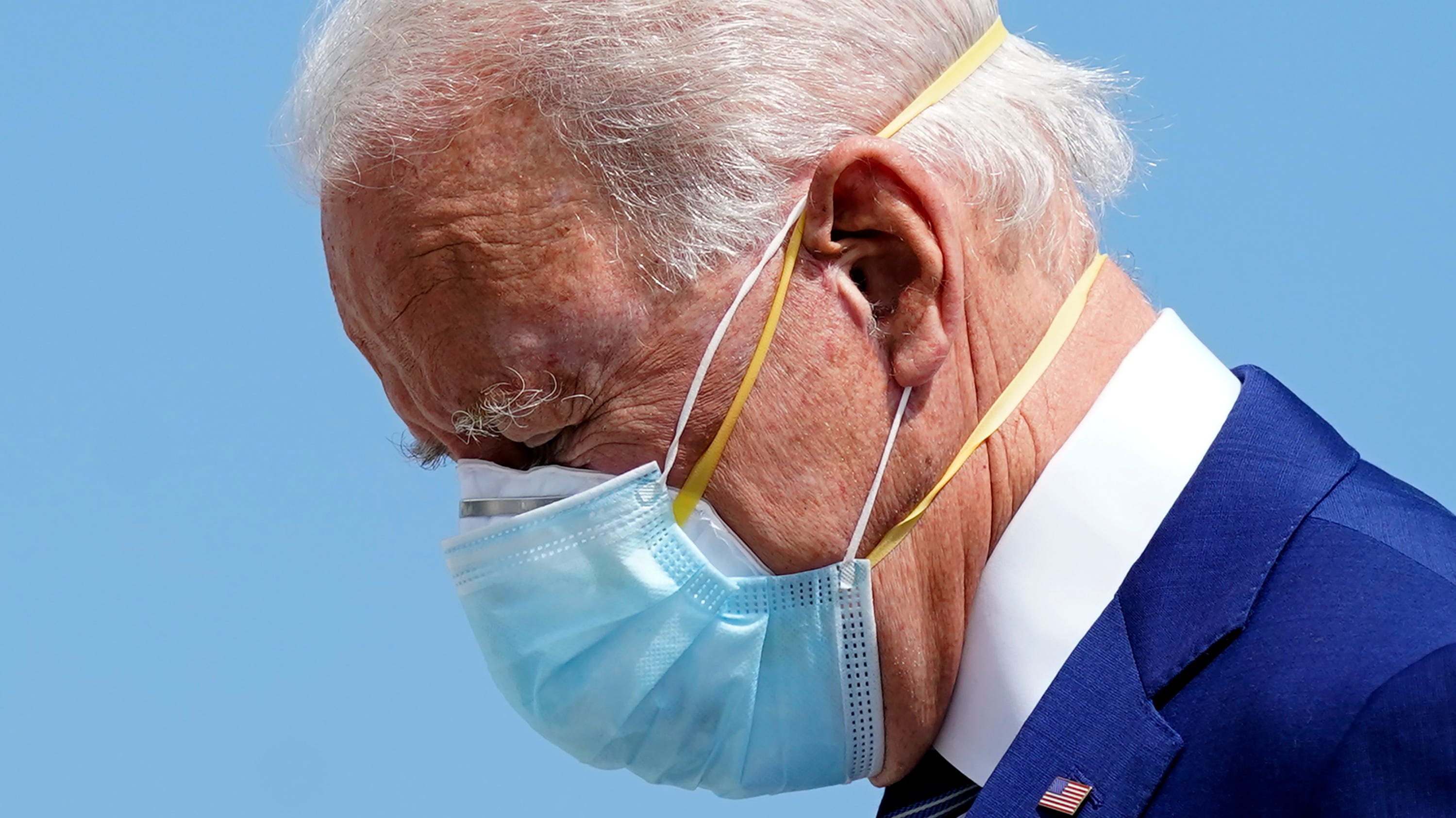 Joe Biden, guarding against COVID-19, is wearing two face masks