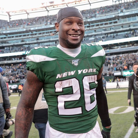 New York Jets running back Le'Veon Bell (26) react