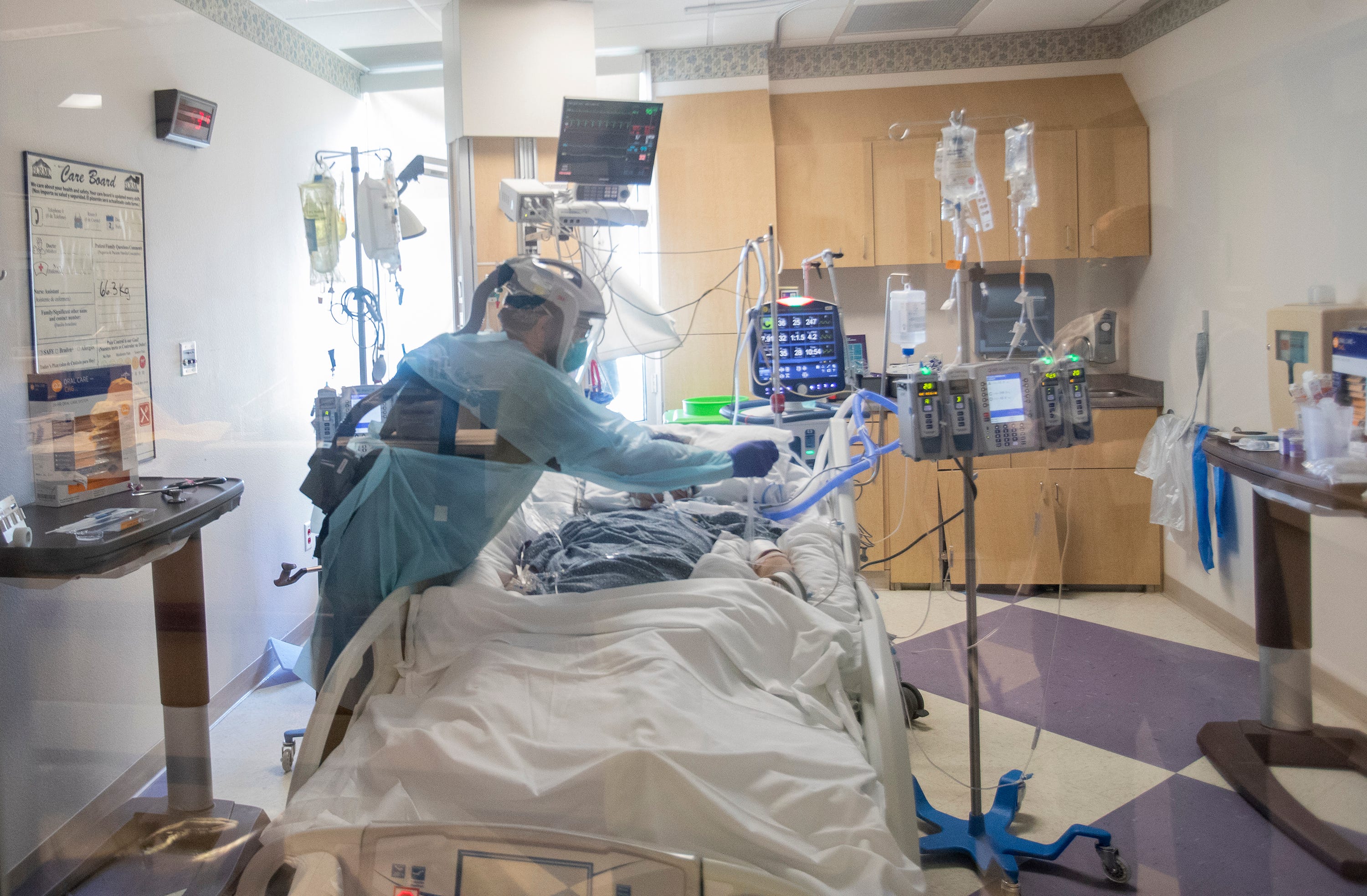 An El Centro Regional Medical Center staff member attends a patient who is COVID-19 positive and has been intubated on May 30, 2020.