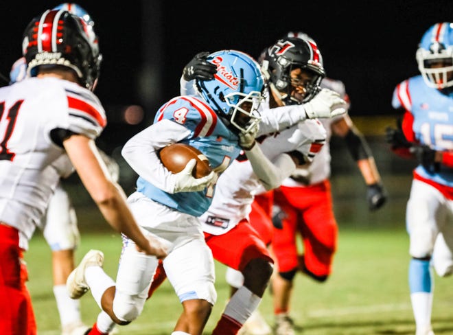 J.L. Mann's Mikel McClellan (4) tries to break a tackle against Hillcrest in 2020.