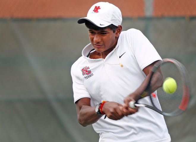 North Central's Ajay Mahenthiran plays Carmel's Broc Fletcher, not pictured, during the IHSAA 2020 Boys Tennis State Finals held at North Central High School, Saturday, Oct. 17, 2020. Mahenthiran won the match. Carmel High School boys took the State Championship title, and North Central boys became the runners up.