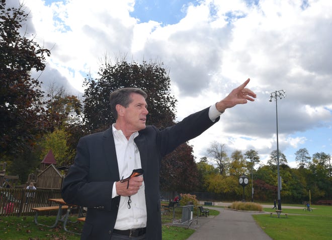 At Northville's Ford Field, Mayor Brian Turnbull points to areas along Griswold and Mill Race Village where the city might contemplate adding new resources as it re-configures its downtown once the Downs are developed.