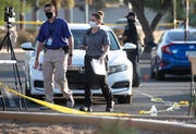 Mesa Police investigate a multiple shooting, Oct. 17, 2020, in a parking lot near Dobson and Guadalupe Roads, Mesa. At least five people were shot during an incident on Friday evening.