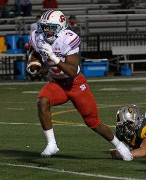 Rummel's Logan Diggs runs the ball against Calvary Friday.