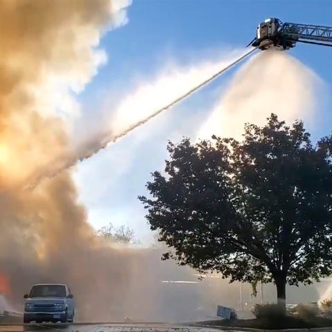 Firefighters battle flames at a shopping center ea