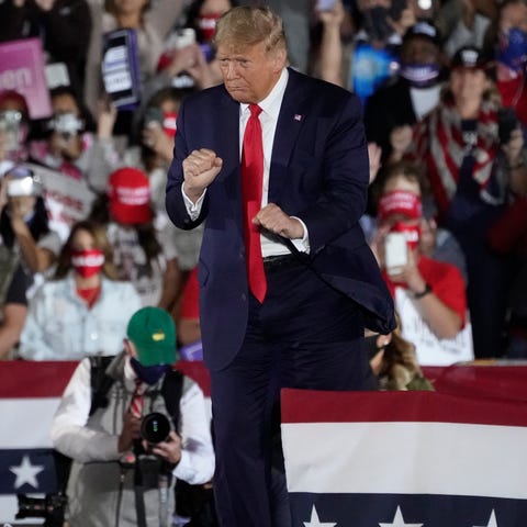 President Donald Trump dances after speaking at a 