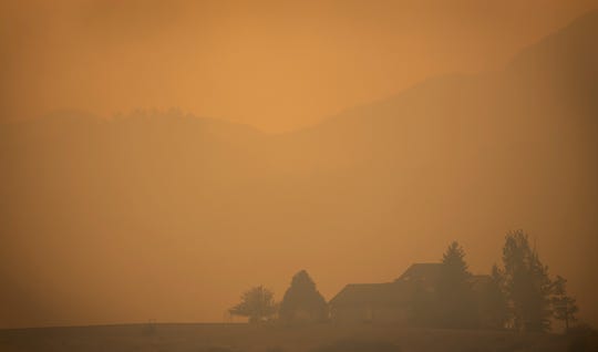 Smoke from the Cameron Peak Fire, the largest wildfire in Colorado history, fills the air in a valley near Masonville, Colo. on Saturday, Oct. 17, 2020.