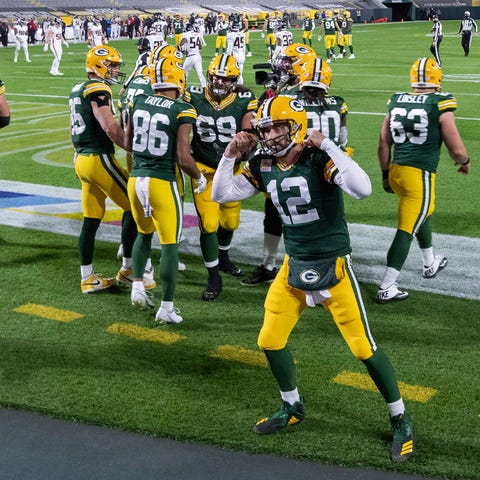 Green Bay Packers quarterback Aaron Rodgers (12) m