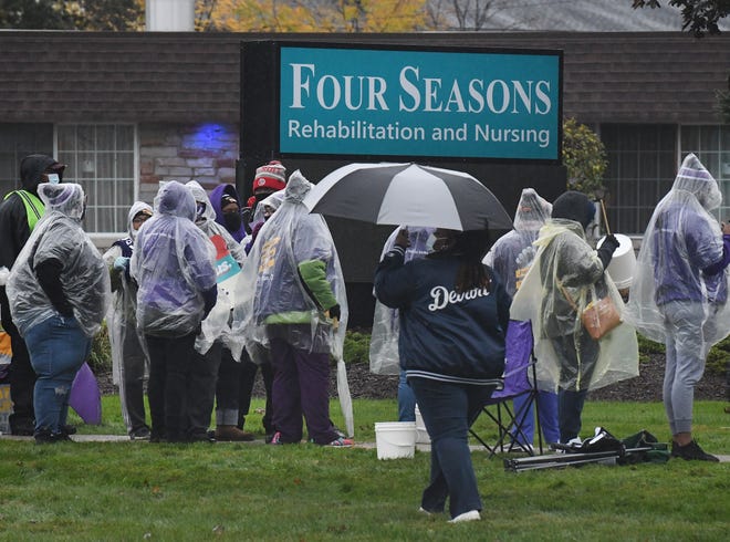 Workers at Four Seasons Rehabilitation and Nursing walk off the job Monday morning, stating unfair labor practices, in Westland, Michigan on October 19, 2020.
