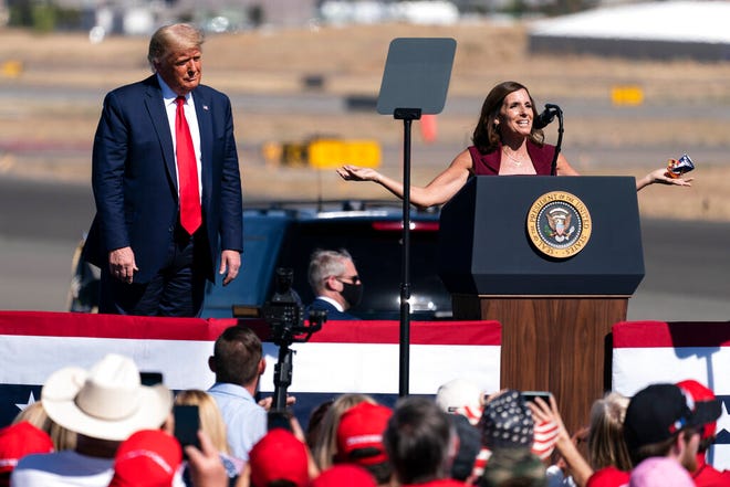President Donald Trump looks on as Sen. Martha McSally, R-Ariz., speaks at a campaign rally at Prescott Regional Airport on Oct. 19, 2020, in Prescott.