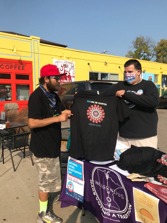 Activists wear masks at a recent gathering in Minneapolis' American Indian Cultural Corridor to register Native Americans to vote this election. Nearly half of the nearly 3 million eligible Native American voters are not yet registered.
