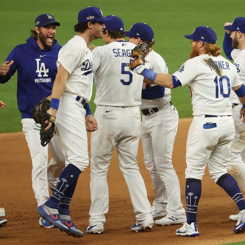 Dodgers players celebrate the final out.