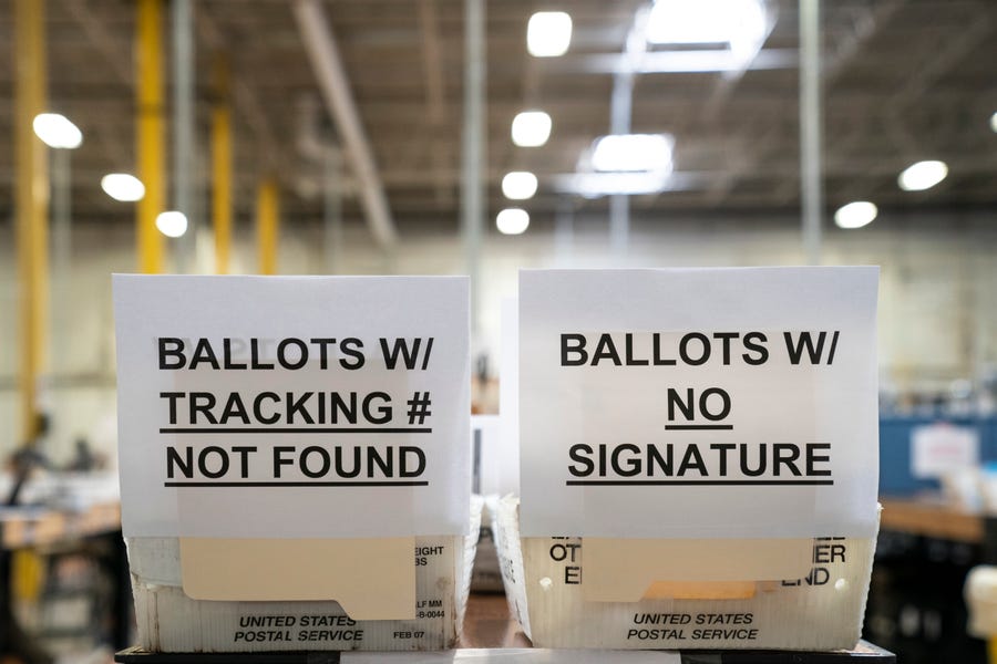 The Anne Arundel County Board of Elections separates problematic ballots at a warehouse in Glen Burnie, Md.