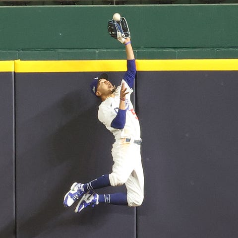 Mookie Betts makes a leaping catch at the wall.