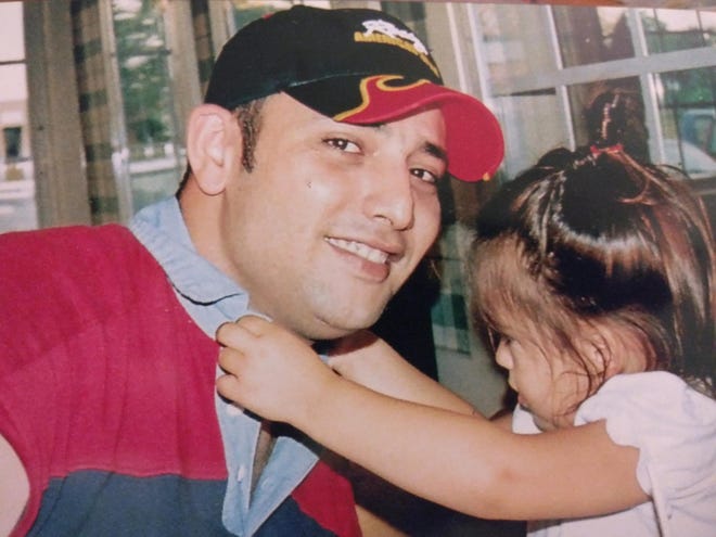 Mohammad Isaifan and his daughter.