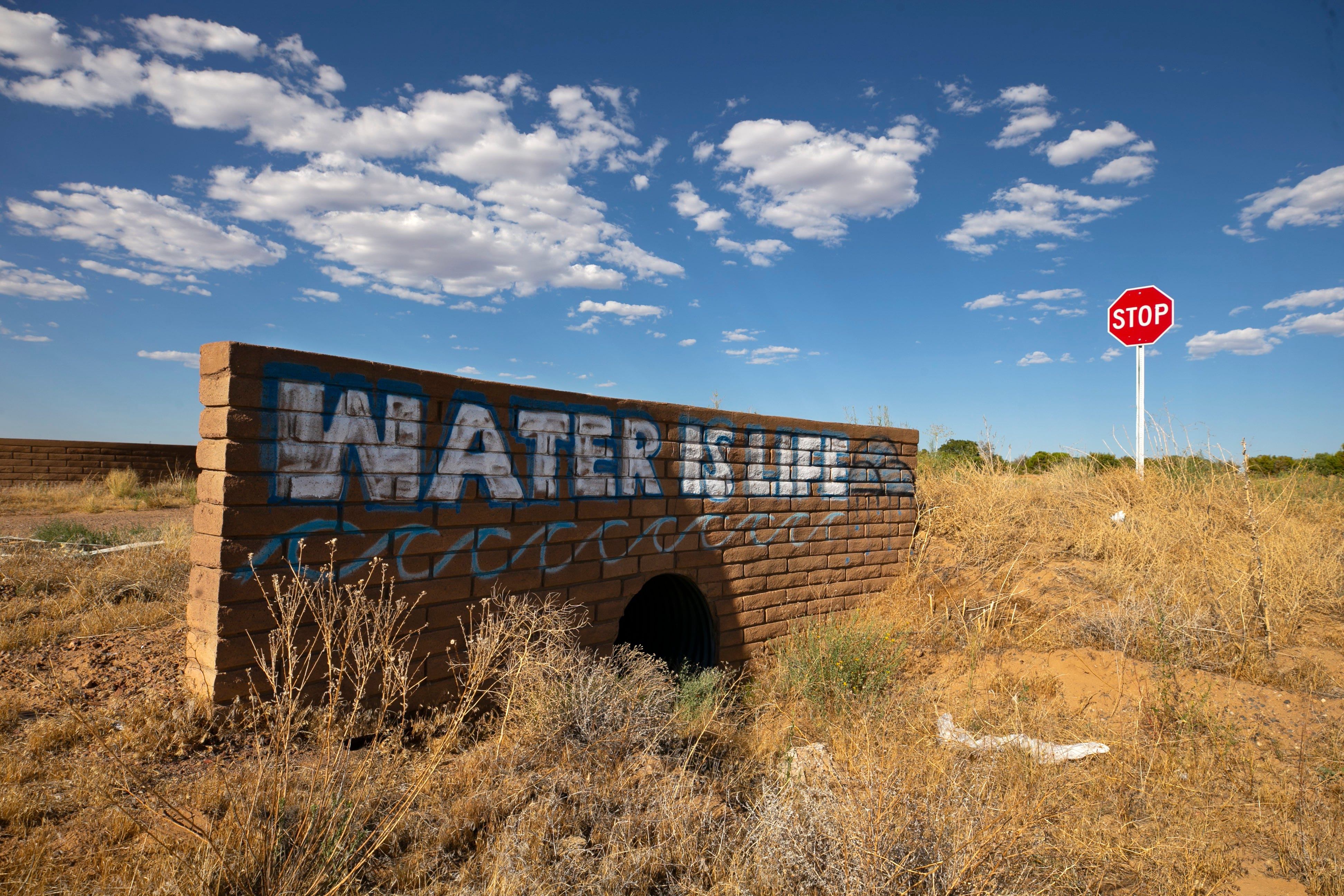 "Water is Life" is painted on a roadside wall over a culvert on Second Mesa on the Hopi Reservation.