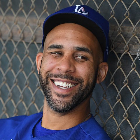 Dodgers pitcher David Price sits in the dugout dur