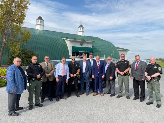 U.S. Congressmen John Joyce, Jim Jordan and Warren Davidson thanked local law enforcement officers for their service at Tuesday's rally at Green Grove Gardens.