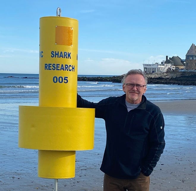 Jon Dodd, executive director of the Atlantic Shark Institute, stands with an acoustic receiver used to detect great white sharks off Rhode Island.