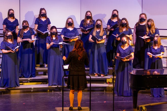 Great Falls High's Select Treble Choir performs in their first concert of the 2020-2021 academic year under the instruction of conductor Jordan Spicher. Students wore special singing masks to allow a clearer vocal performance while wearing masks to protect others from aerosols produced by singing during the ongoing COVID-19 pandemic.