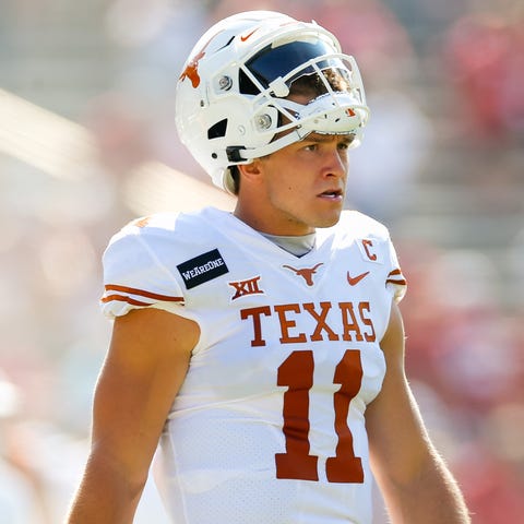 Sam Ehlinger paces the sideline during the Red Riv