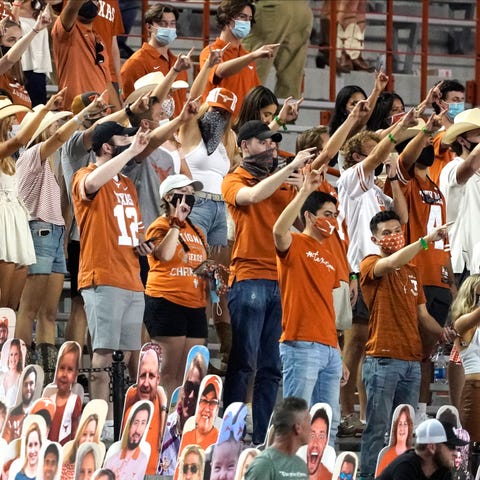 Texas fans sing "The Eyes Of Texas" after a game t