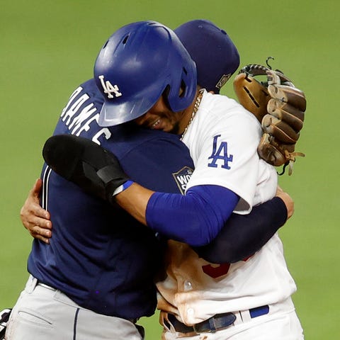 Rays shortstop Willy Adames hugs Mookie Betts afte
