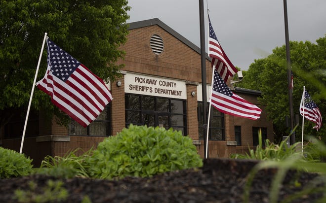 Flags surround the Pickaway County sheriff's office in Circleville in May 2020.