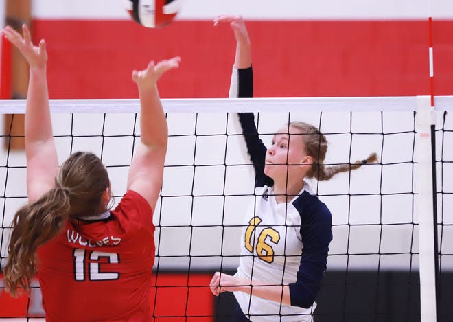 Notre Dame High School junior Katy Stephens puts down a kills during Wednesday's Class 1A regional quarterfinal against Winfield-Mount Union.
