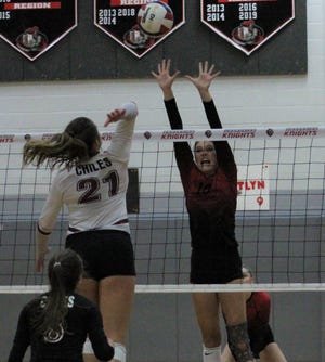 Creekside middle blocker Alli Jackson (10) leaps high for the block against Tallahassee Chiles' Anna Corry (21) during the fourth set of the FHSAA Region 1-6A volleyball quarterfinal on October 21, 2020. [Clayton Freeman/Florida Times-Union]