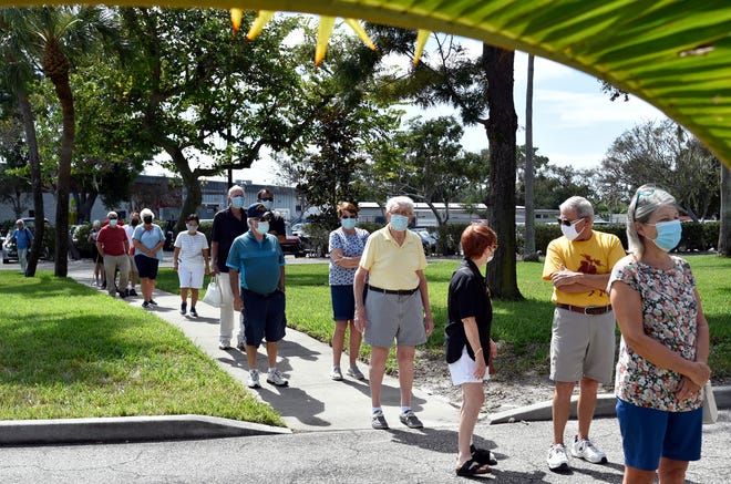 People line up at a Manatee County early voting site to cast their ballots in 2020.