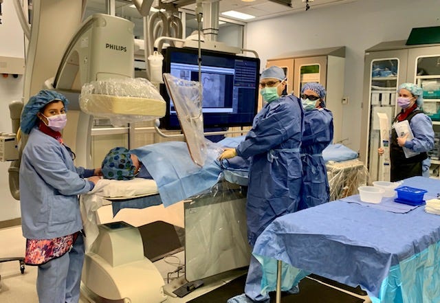 Dr. Alex Kirby, CarolinaEast Cardiologist, performs a life-saving heart procedure with his Cath Lab team.