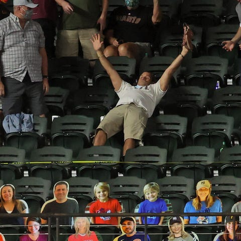 A fan catches the home run hit by Los Angeles Dodg
