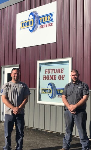 Owner Ryan Ford (left) and manager Chris Royer of Ford Tire in Newcomerstown.