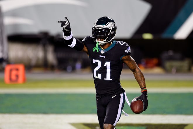 Philadelphia Eagles' Jalen Mills reacts after intercepting a pass during the first half of an NFL football game against the New York Giants, Thursday, Oct. 22, 2020, in Philadelphia.
