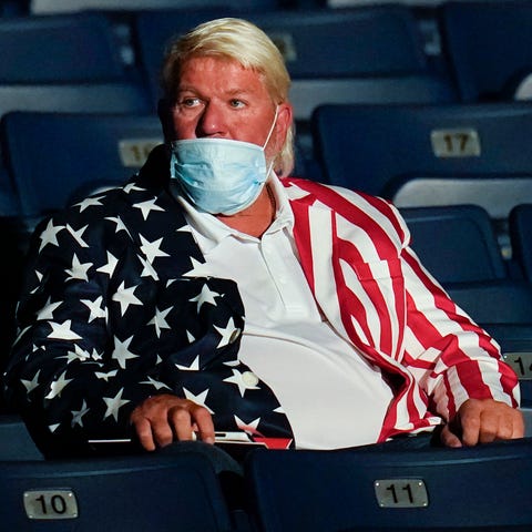 PGA golfer John Daly takes his seat ahead of the s