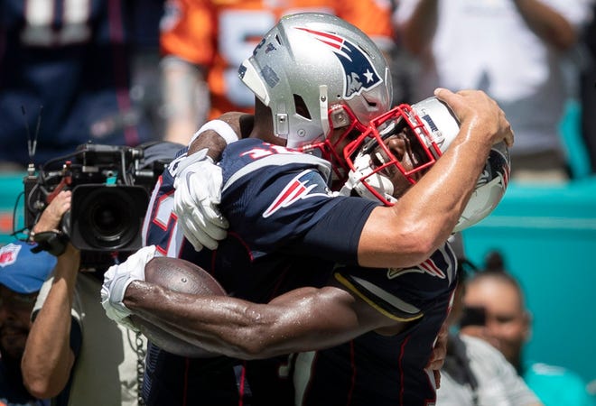 Tom Brady and Antonio Brown, embracing after connecting on a touchdown pass against the Dolphins last season while both were playing for the Patriots, are reunited again with Tampa Bay.