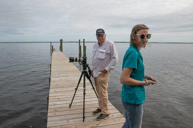 Riverkeeper Katy Langley Hunt and water activist Rick Dove look over a fish kill at Carolina Pines. [Bill Hand / Sun Journal Staff]