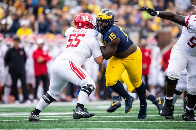Michigan defensive tackle Chris Hinton rushes against Rutgers at Michigan Stadium in Ann Arbor on Sept. 28, 2019.