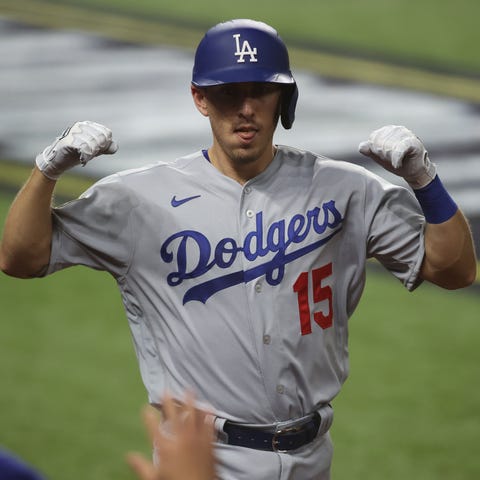 Austin Barnes reacts after hitting a home run in t