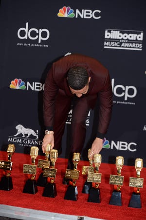 Drake displays his awards in the press room during the 2019 Billboard Music Awards at the MGM Grand Garden Arena on May 1, 2019, in Las Vegas, Nevada.