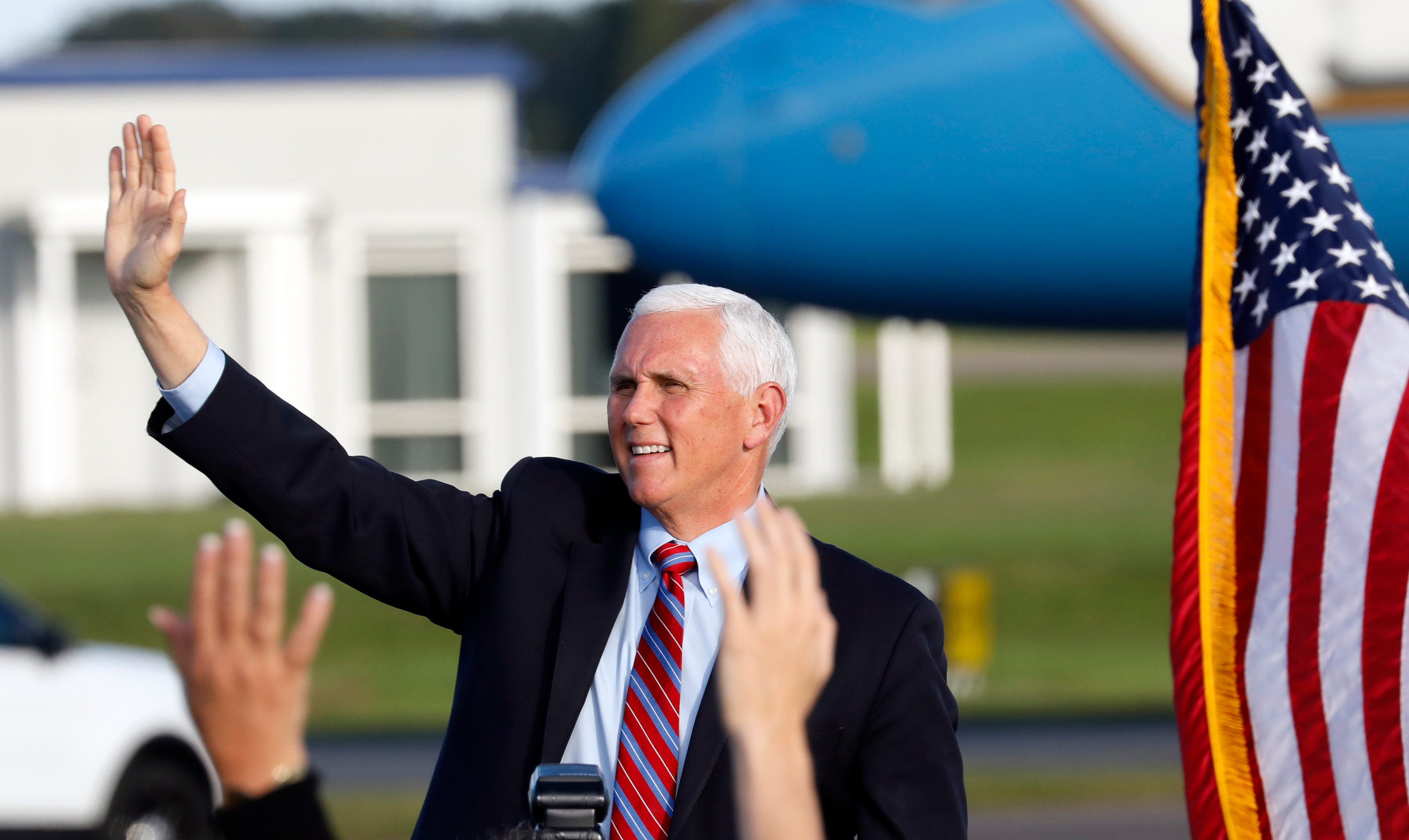 Vice President Mike Pence waves to a crowd of more than 1,000 people at Lakeland Linder International Airport before the start of the "Make America Great Again Victory Rally" on Saturday.