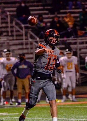 Waverly’s Haydn’ Shanks throws a pass during a game against McNicholas Saturday night in a Division four regional quarterfinal game in Waverly, Ohio, on Oct. 24, 2020. Waverly defeated McNicholas 34-13.