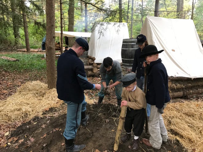 Re-enactors from the 23rd Ohio Volunteer Infantry built a winter camp at Spiegel Grove as part of an event hosted by the Rutherford B. Hayes Presidential Library and Museums on Saturday.