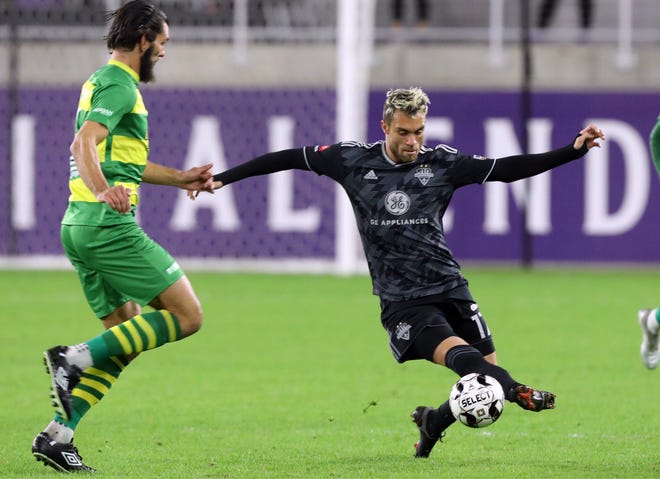 Louisville City FC's Cameron Lancaster (17) fights pressure from Tampa Bay Rowdies' Forrest Lasso (3)during the first half of play in the Eastern Conference Final game at Lynn Family Stadium in Louisville, Kentucky.     October 24,  2020.