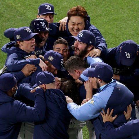 The Rays celebrate their walk-off victory in Game 