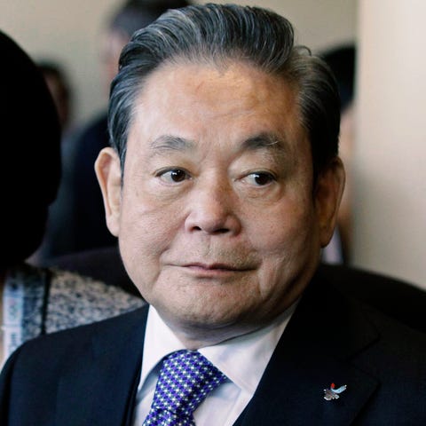 Samsung Chairman Lee Kun-hee is pictured greeting 