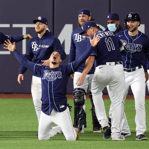 The Rays celebrate their walk-off win against the 