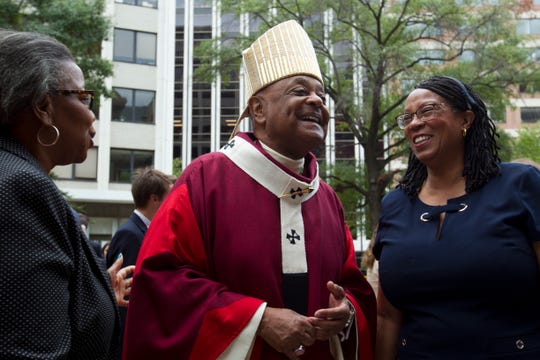 In this Sunday Oct. 6, 2019, file photo, Washington D.C. Archbishop Wilton Gregory greets churchgoers at St. Mathews Cathedral after the annual Red Mass in Washington.