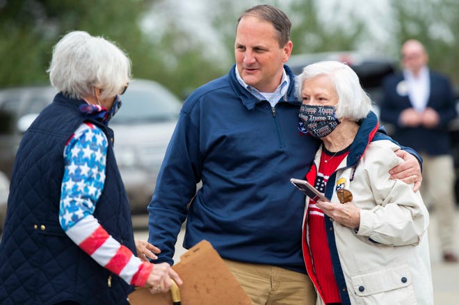 GOP Chairman Scott Golden arrives from the Republican "Road to Victory" Tour Bus at Medina Municipal Building and greets Nancy House and Judy Bowers in Medina, Tenn., Monday, Oct. 26, 2020.  